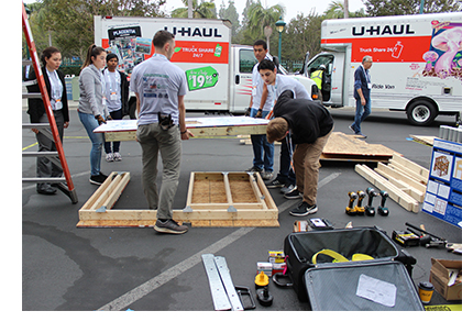 U-Haul trucks arrive with building materials